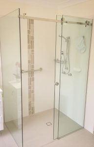 shower screen with sliding door and chrome fixtures and fittings
